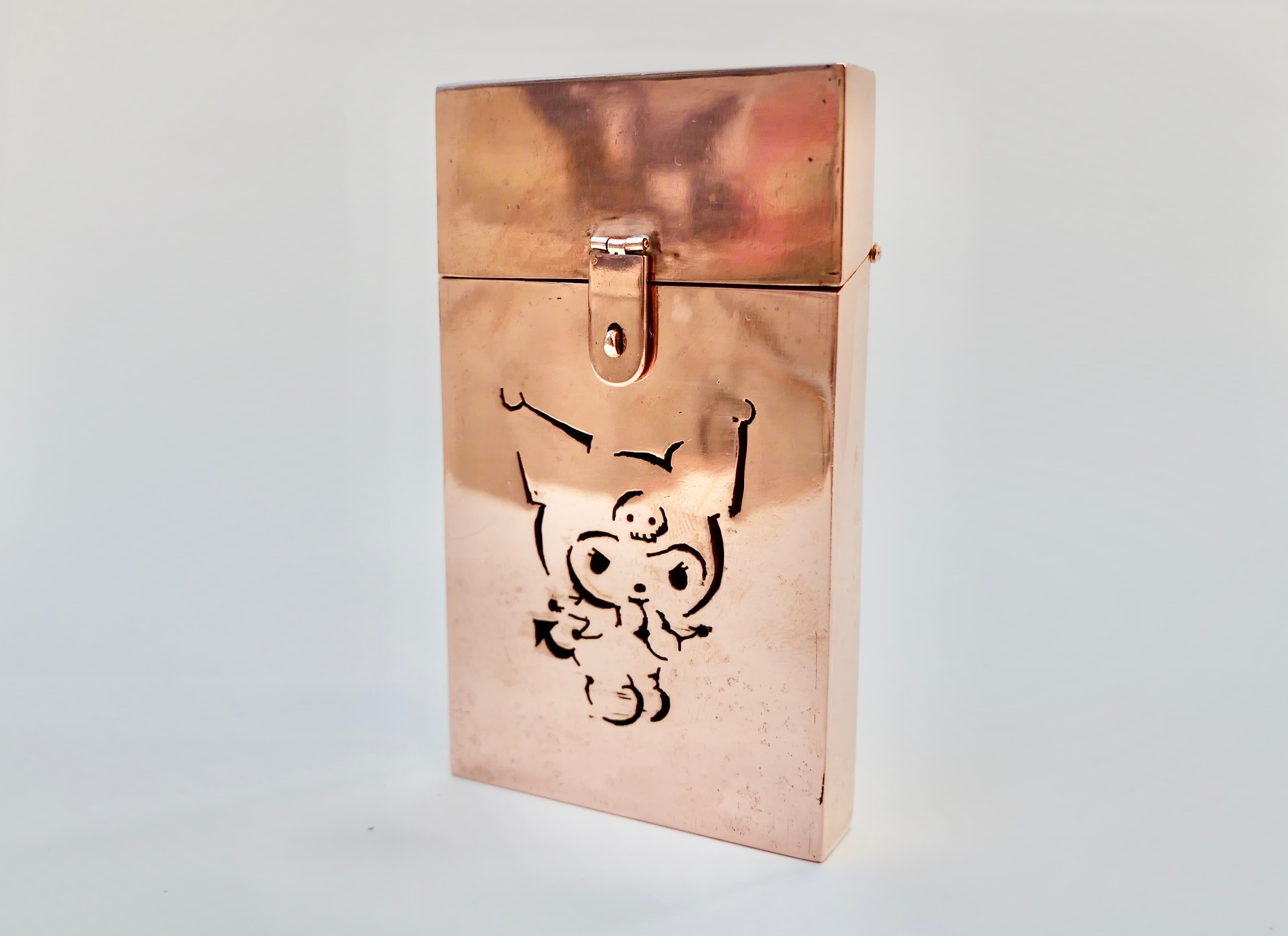 copper hinged box with clasp and decorative cut out